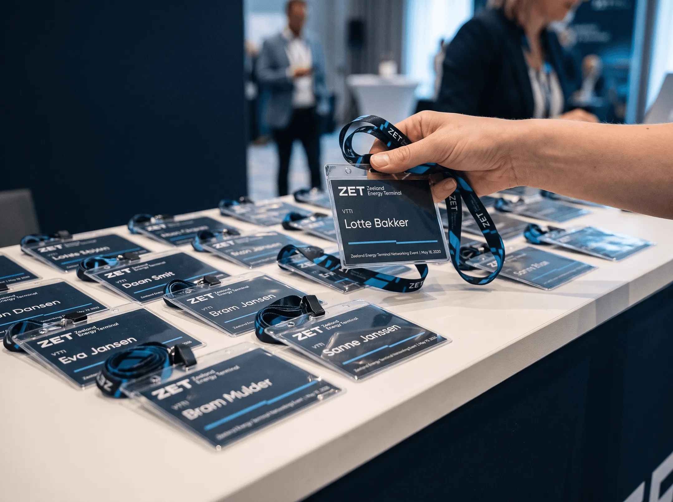 ZET name badges and lanyards laid out on the registration desk