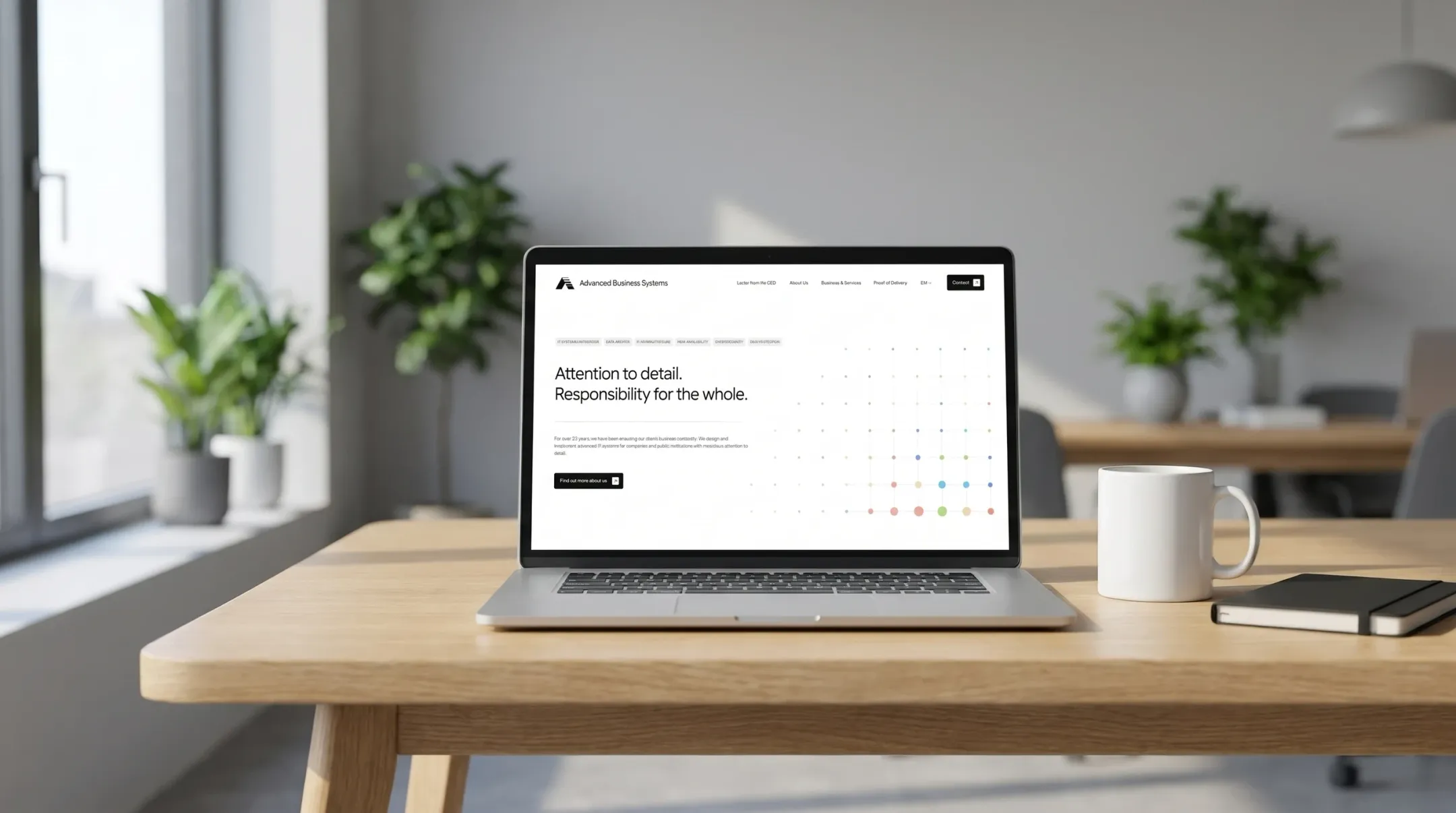 The Advanced Business Systems website on a laptop