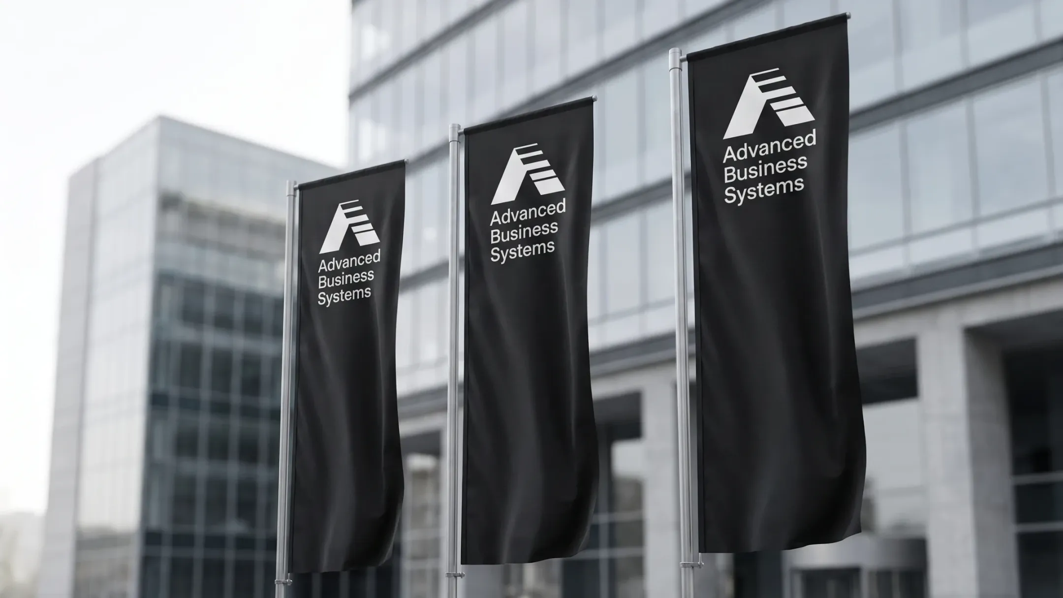 Advanced Business Systems flags outside an office building